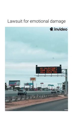 Hist Humor on Instagram: "This video features a digital highway safety sign displaying a message that links Valentine's Day to automotive safety. (via:tt/ frances.84) The Subject The footage captures a variable message sign (VMS) positioned over a public roadway. These electronic traffic control devices are managed by transportation authorities to relay real-time information to drivers regarding traffic conditions, emergencies, or safety reminders. The Mechanism A three-point seatbelt system uti