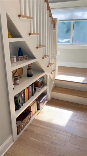 Concetta Sasso Alvarez on Instagram: "This staircase was designed to do more than connect levels. ✨ Built-in shelving transforms unused space into functional storage while keeping the design clean, intentional, and seamless with the rest of the home. Thinking about ways to maximize space in your home? DM us today. #ERSBetterHomes #CustomHomeDesign #HomeRenovation"