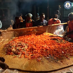 15M views · 15K reactions | A popular breakfast street food snack in Uganda, this supersized Rolex (rolled eggs) was created by Raymond Kahuma and friends | Guinness World Records | Facebook