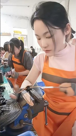 Focused hands, skilled work. 🔧✨Factory life where precision meets dedication