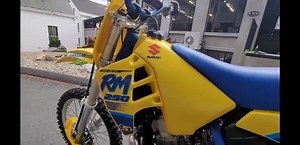 3K views · 137 reactions | 1989 SUZUKI RMZ 250 RESTORATION CHECKOUT FULL UPLOADS ON KAPLAN AMERICA YOUTUBE.... . . . . #suzuki #rm #rmx250 #2stroke #90smotocross #90senduro #enduro #throttlejunkie #motocross #supercross #renthal #showa #fmf #vintagebikes #vintagemx #vintagemotorcycle #twinair #StaigerGraffics #dunlop #kingOFping #explore #boyesen #kaplanamerica #kaplancycles | Kaplan Cycles | Facebook