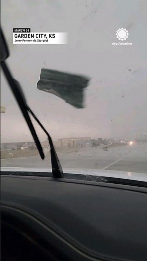 Debris Flies at Car During Possible Tornado in Garden City, Kansas