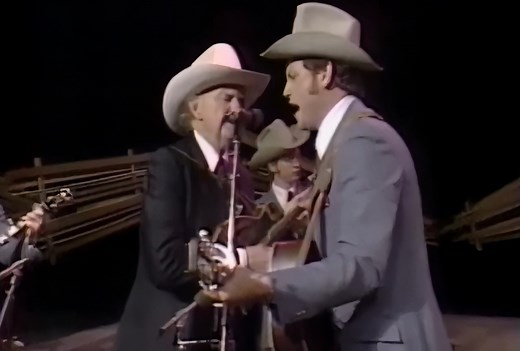 Bill Monroe - In The Pines (1952 Version) Bill Monroe's 1952 rendition of "In the Pines," also known as "Where Did You Sleep Last Night?", captures the essence of bluegrass music, rooted in 19th-century Appalachian folk traditions. Monroe’s high, lonesome voice and intricate mandolin playing bring haunting emotion to the song's themes of loneliness and sorrow. The instrumental arrangement, featuring the mandolin, fiddle, banjo, guitar, and upright bass, creates a rich, melancholic atmosphere. Th