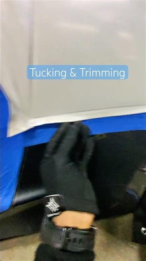 Tucking & Trimming using wrap axe masking tape use to keep the wrap from sticking so you can lift