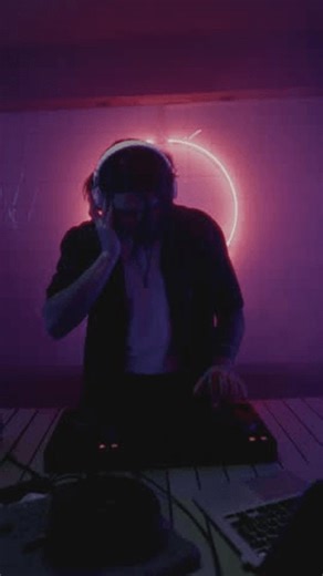 clip-3994472281-man-dj-playing-music-on-electronic-mixer