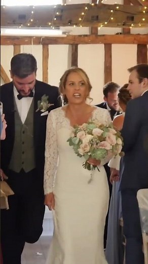 bride and groom walk up the aisle