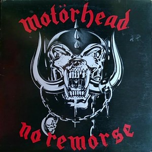 On this day in 1984, Motorhead release No Remorse. In addition to the usual cardboard sleeve, the original LPs were also available in a real leather sleeve which had silver on black artwork, completely reworked by Joe Petagno in much finer detail than the original with various differences (such as an iron cross). There was a cassette version released in a leather pouch with wording mimicking the Government Health Warning often found on a cigarette packet, about the contents being potentially dam
