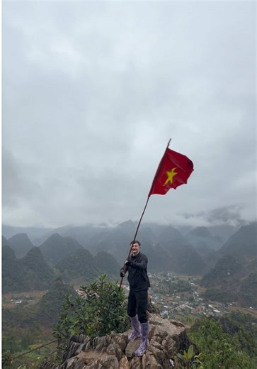 Waving the Vietnamese Flag on Ha Giang Loop Tour