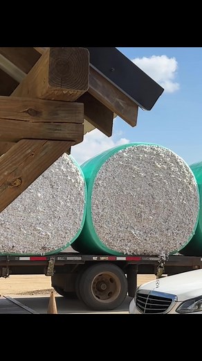 Skilled Truck Drivers Maneuvering 8 Cotton Modules