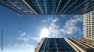 A timelapse of the cloud reflecting the mirror of the building