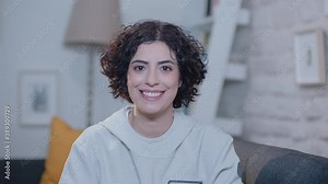 Young woman laughing at the camera.Portrait of beautiful smiling woman. Stock Video