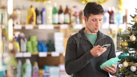 Checking Expiration Date of Spray Glass Cleaner for Windows - Male Shopper Scans QR Code on Label of Spray Glass Cleaner Stock Video - Video of modern, shelf: 457598973