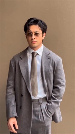 CNN Style on Instagram: "@heatedrivalrycrave star @hudsonwilliamsofficial arrives at @giorgioarmani’s @milanfashionweek show, showing off his ring for “protection” #milanfashionweek #mfw #hudsonwilliams #heatedrivalry"