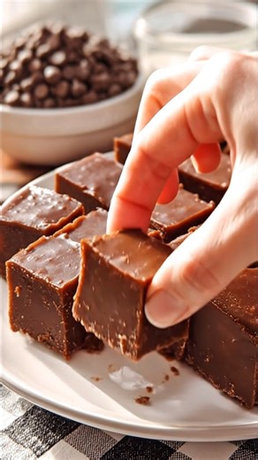 3 Minute Fudge *Every now and then, you come across a recipe that feels like a little gift — the kind you tuck away because you know you’ll come back to it again and again. This classic 3-minute fudge is rich, creamy, and wonderfully simple, just like the old-fashioned treats many of us grew up enjoying during the holidays.* What You'll Need 1 (14 oz) can sweetened condensed milk 2 cups semi-sweet chocolate chips 2 tablespoons unsalted butter 1 teaspoon vanilla extract How to Make It 1. Line an 