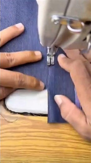 sewing dark blue fabric patterns using a professional electric sewing machine for quality output