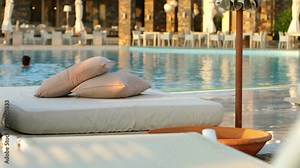 Beach loungers and floating in the pool, the woman Stock Video