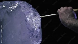 Creation of an ice sculpture in the studio using a chisel and hammer, 4k