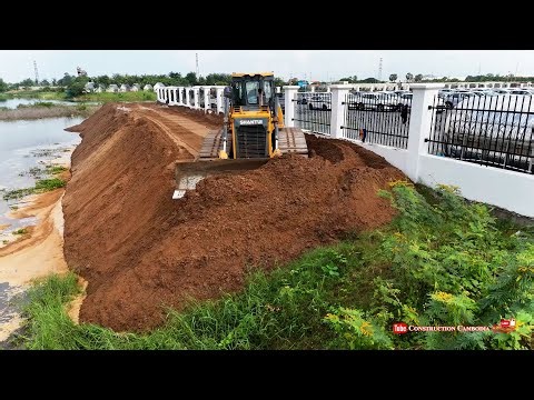 Best Powerful Dozer Pushing Sand With Dump Trucks Dumping Sand Next to Water Wall Flood Defense