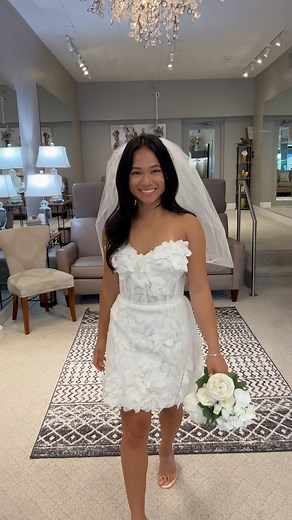 19 reactions | This is your sign to get a fun bridal mini dress for...