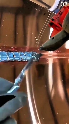 Welding shiny seam with torch and filler rod precision