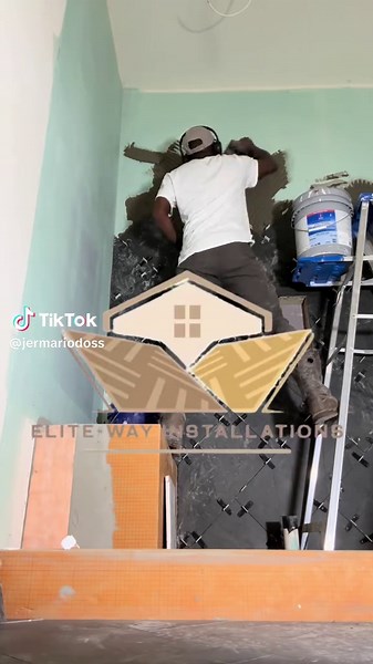 Master Shower Back Wall Installation with Herringbone Pattern