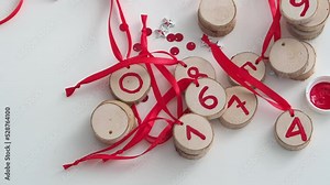 Festive background for new year and merry christmas. A set of Christmas tree decorations made of wood, made by hand. Christmas tree advent calendar with gifts. Top vew