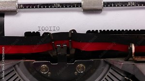 sequence of ones and zeros in binary code written with old typewriter with black ink Stock Video
