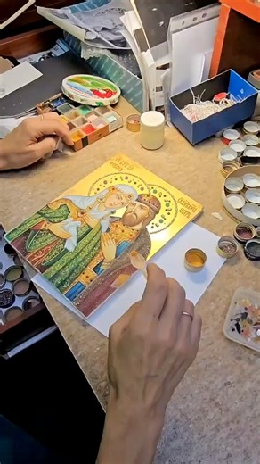 WRITING AN ICON WITH SEMIPRECIOUS STONES This video shows an artist from our monastery workshop creating an icon of Saints Peter and Fevronia, the patron saints of Christian marriage and family life. The artist isn't using traditional tempera or acrylics, but natural pigments made from finely ground semiprecious stones and minerals. Using a miniature spoon, the artist is carefully applying the stone mixture onto the outlined image—a meticulous and prayerful process. 🔔 If this sacred art resonat