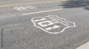 Pacific ocean Coast Highway road marking on asphalt, historic route 101, California State Route 1 roadtrip. Iconic emblem sign on freeway with dividing line in Oceanside, USA. Scenic road trip signage
