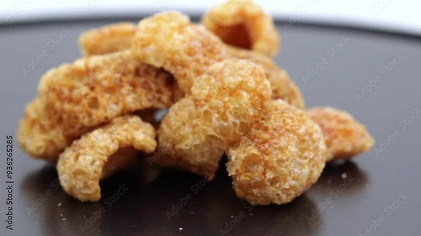 Homemade pork rinds or chicharrones carnudos in Spanish, easy to make in a kitchen pan. They are crunchy, meaty and delicious.