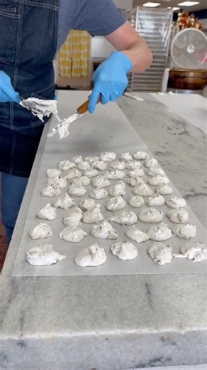 It's actually sweet how Bud carefully hand crafts Grandma Marshall's Divinty. Have you ever tried this amazing treat? It's a delightful mix of marshmallows, egg whites, and pecan that are hand-spooned into fluffy bites. Take a bite into Divinity to experience the heavenly goodness! Shop online at: https://marshallsfudge.com/pecan-divinity-puffs/ #marshallsfudgeandcandycompany #mackinawcity #divinity #GrandmaRecipes | Marshall's Fudge