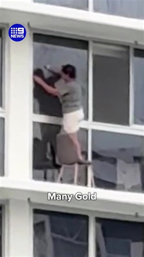 A Gold Coast woman's cleaning methods has raised eyebrows online, filmed balancing on a chair to wipe down a window 16 storeys high! #9News | 9 News