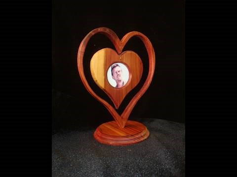 Make a heart-in-a-heart picture frame with wood. Awww...it's cute.
