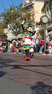 Clarabelle Cow (Goofy's Girlfriend) dancing down Main Street USA at Disneyland during the parade! | Amy's Magic & Miles Travel Blog