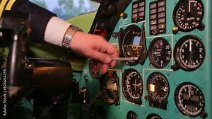 Pilot explains indicators on the instrumental panel of the aircraft.