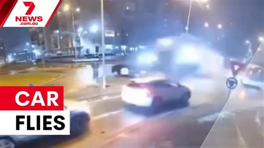 Car launches over roundabout in Romania