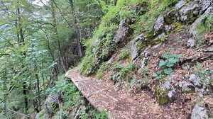 Ceska Koca mountain hut on the way to Grintovec Mountain in Julian Alps, Slovenia. A picturesque rest stop for hikers amidst breathtaking alpine scenery.