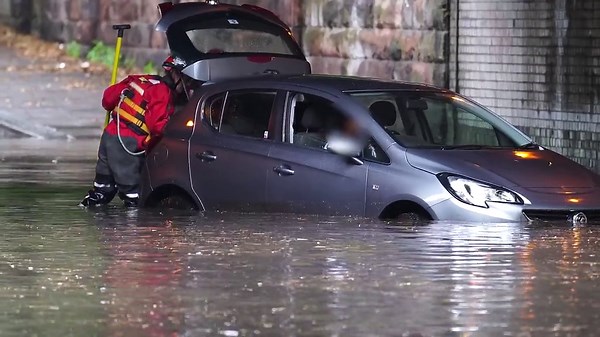 Merseyside Firefighters rescue driver in Liverpool as flash floods hit the city