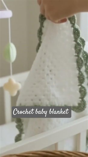 white baby blanket with sage green border available on etsy shop link in bio.