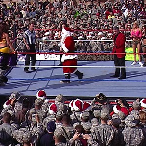 Santa Cena gives Mr. McMahon an Attitude Adjustment