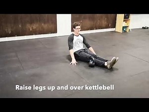 Seated Leg Raise Over Kettlebell