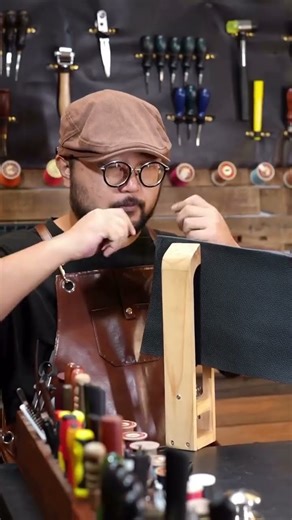 "Handcrafted excellence 🧵✨ Watch a leather craftsman transform raw black leather into a premium