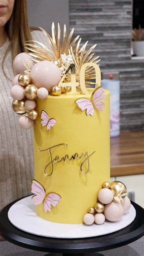 Extra tall cake for Jenny's 40th! 🥰 I used colourmill oil based colouring in yellow and caramel to achieve that golden yellow hue in my spread ganache. 6 inch frost form kit, extra tall 6 inch liner, colourmill and scraper from frostform.com - use code FROSTLOVE10 for 10% off at frostform.com checkout #birthdaycake #tallcake #cake #cakedecorating #40thbirthdaycake #lemoncake #cakedesign #cakemaker #frostform #loveisbakeable | Loveisbakeable