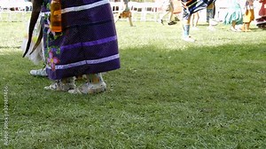 Two Native American Women First Nations Indians Dancing In Gear On Grass With People In Background