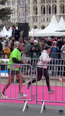 Marathon Runner Crosses Finish Line With Pineapple on His Head
