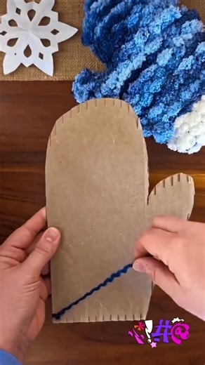 Crafts Art on Instagram: "Cardboard Loom Woven Mittens ❄️ Using cardboard to create hand woven mittens! I cut notches around the top and bottom of a piece of cardboard cut into a mitten shape, then wrapped yarn around the tabs of the cardboard. Once you are done weaving you can pull the yarn off the loom and you have a mitten shaped cloth! I sewed two together using a blanket stitch to make a mitten! #kidcraft #easycraft #christmascrafts #cardboardcrafts #holidaygifts #uaelife #uae #usa🇺🇸"