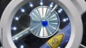 Fresh water test. Performing a water suitability bacteria testing under a microscope