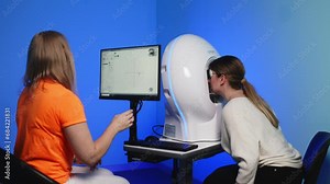 Precise visual field testing using an automatic computer perimeter for comprehensive eye health assessment in a clinical setting. Stock Video