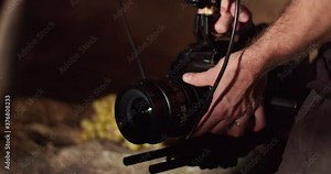 Caucasian adult male hands adjust glass lens of professional business new digital technology, blackmagic camera URSA Mini Pro camera equipment, ultimate high bandwidth recorder, static close up