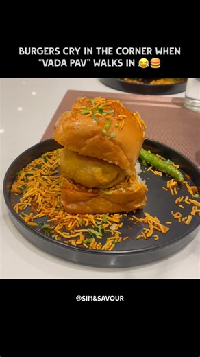 Sim & Savour on Instagram: "What’s your favourite ?❤️ Burger or Vada pav ??? . . [ food meme, bada pav, mumbai street food, indian cuisine, taste, authenticity, indian street food, explore page, follow, million views] #reels #fyp #mumbai #streetfood #viralreels #trending #explorepage✨ #reelkarofeelkaro #followforfollow #reelsinstagram #foodmeme"